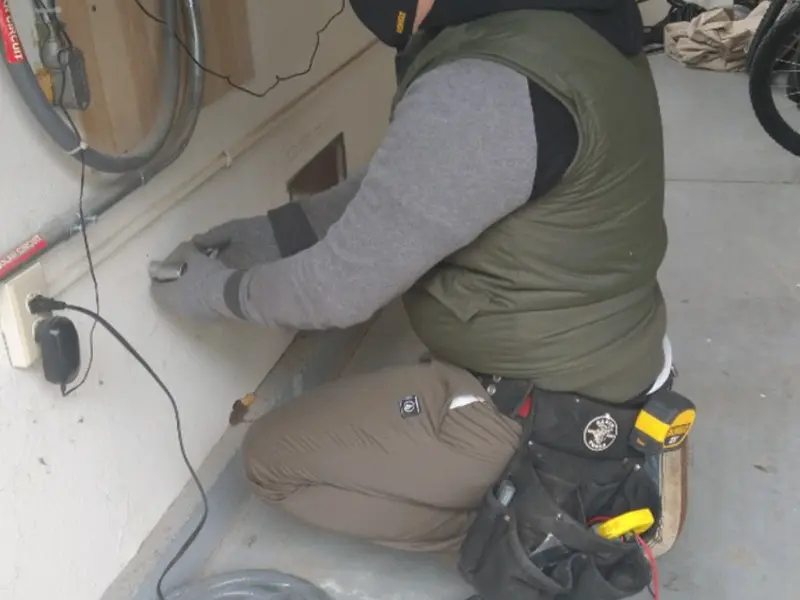 Electrician performing outlet wiring in a Suisun City garage